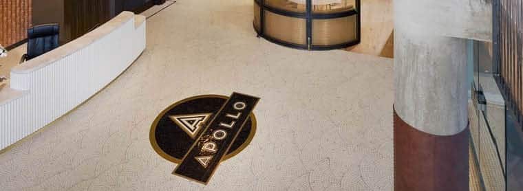 View of custom floor mosaic of The Apollo in the front of concierge.