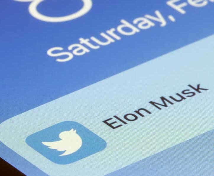 Twitter notification from Elon Musk on a smartphone