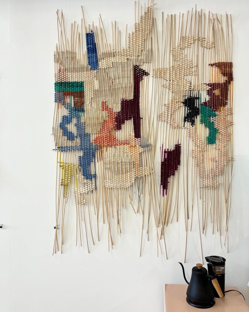 Woven fabric hanging on wall