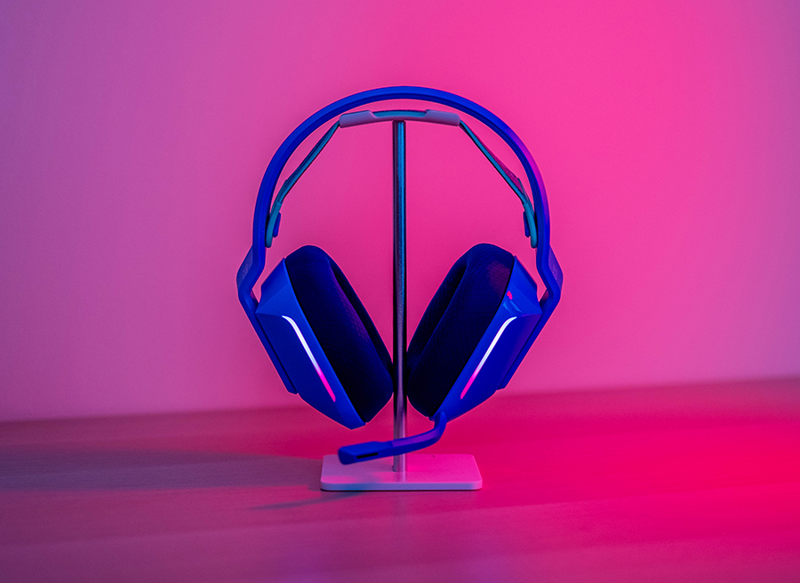 headphones in stand with pink lighting