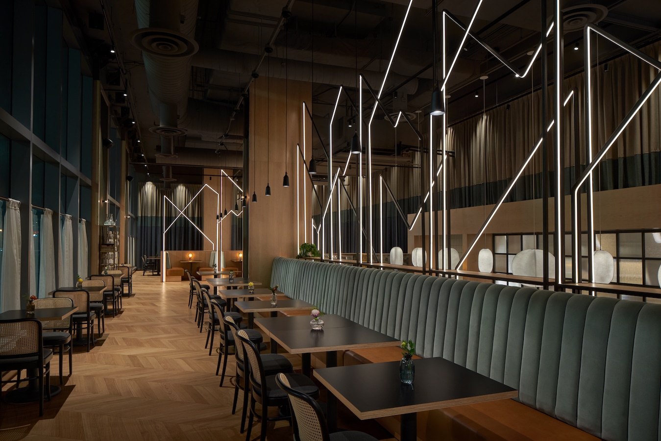 booths beneath intricate restaurant lighting