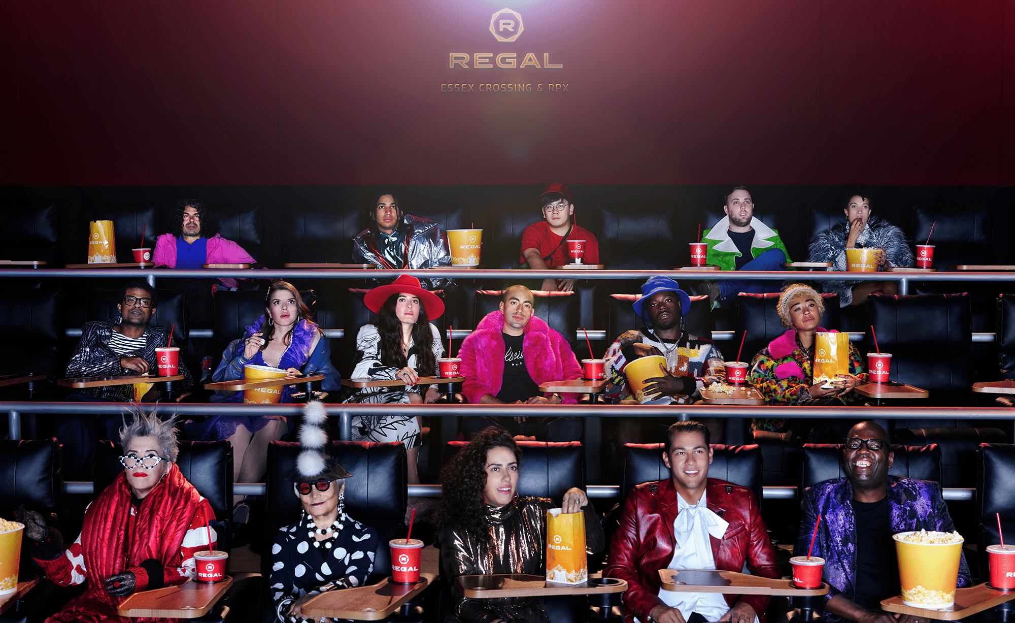 well dressed people sitting in a movie theater