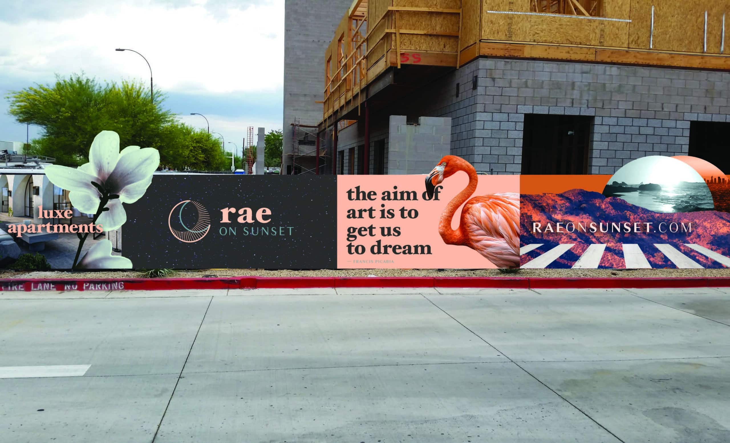 A construction billboard with a pink flamingo on it, with text that reads: "The aim of art is to get us to dream."