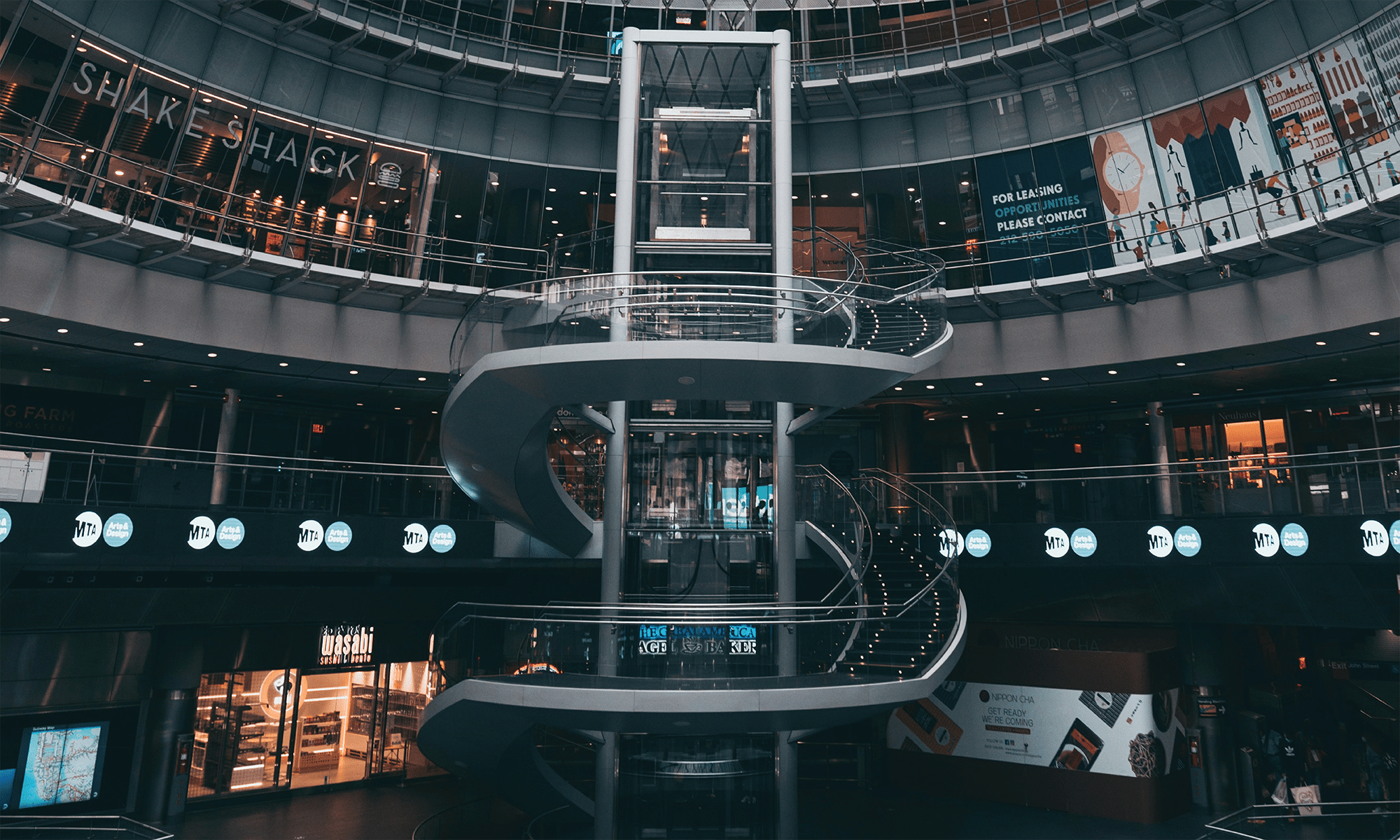 A spiral staircase in a New York City subway station.